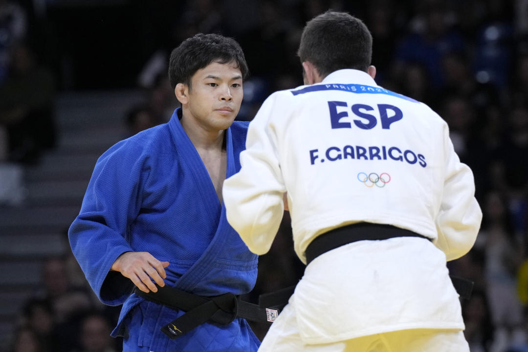 Francisco Garrigos y Ryuju Nagayama (AP/Eugene Hoshiko)