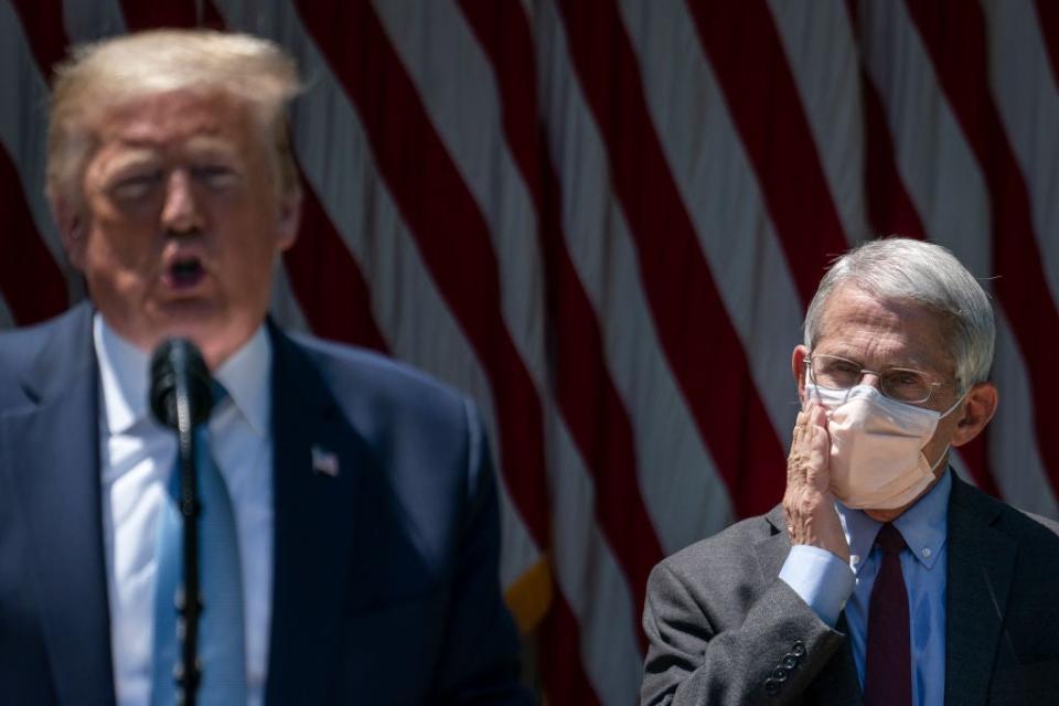 Dr Fauci looks on as president Trump delivers remarks about coronavirus vaccine development in the Rose Garden of the White House on May 15, 2020Getty Images