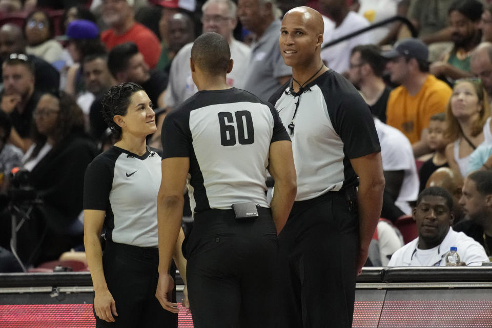 Former NBA player Richard Jefferson, right, speaks with other officials before officiating part of an NBA summer league basketball game between the Portland Trail Blazers and the New York Knicks, Monday, July 11, 2022, in Las Vegas. (AP Photo/John Locher)