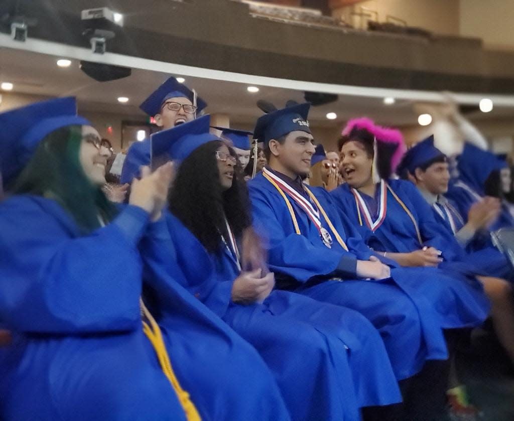 Graduates of this year's blind class celebrate at the Florida School for the Deaf and the Blind graduation.