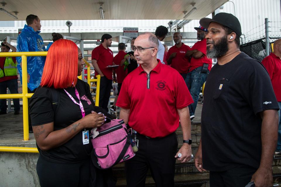 UAW President Shawn Fain talks to Ford worker Florence Dixon, left, outside of Ford's Michigan Assembly Plant in Wayne on July 12. Fain met with President Joe Biden on Wednesday as contract talks with the Detroit Three are now underway.