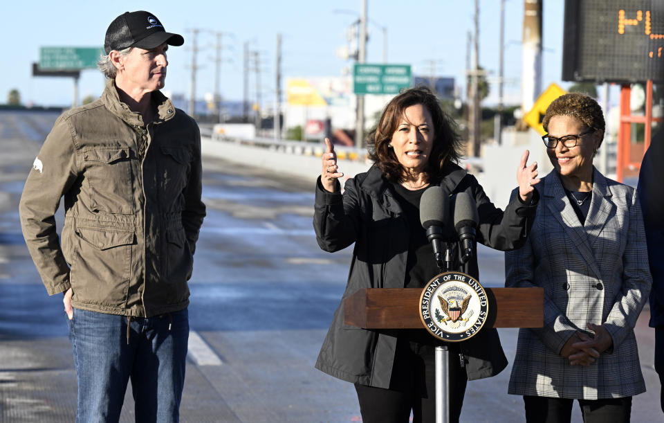 Vice President Kamala Harris, center, speaks with California Gov. Gavin Newsom, left, and Los Angeles Mayor Karen Bass about the I-10, which was closed by an underpass fire on Saturday, Nov. 11, 2023, in Los Angeles, Sunday, Nov. 19. (AP Photo/Alex Gallardo)