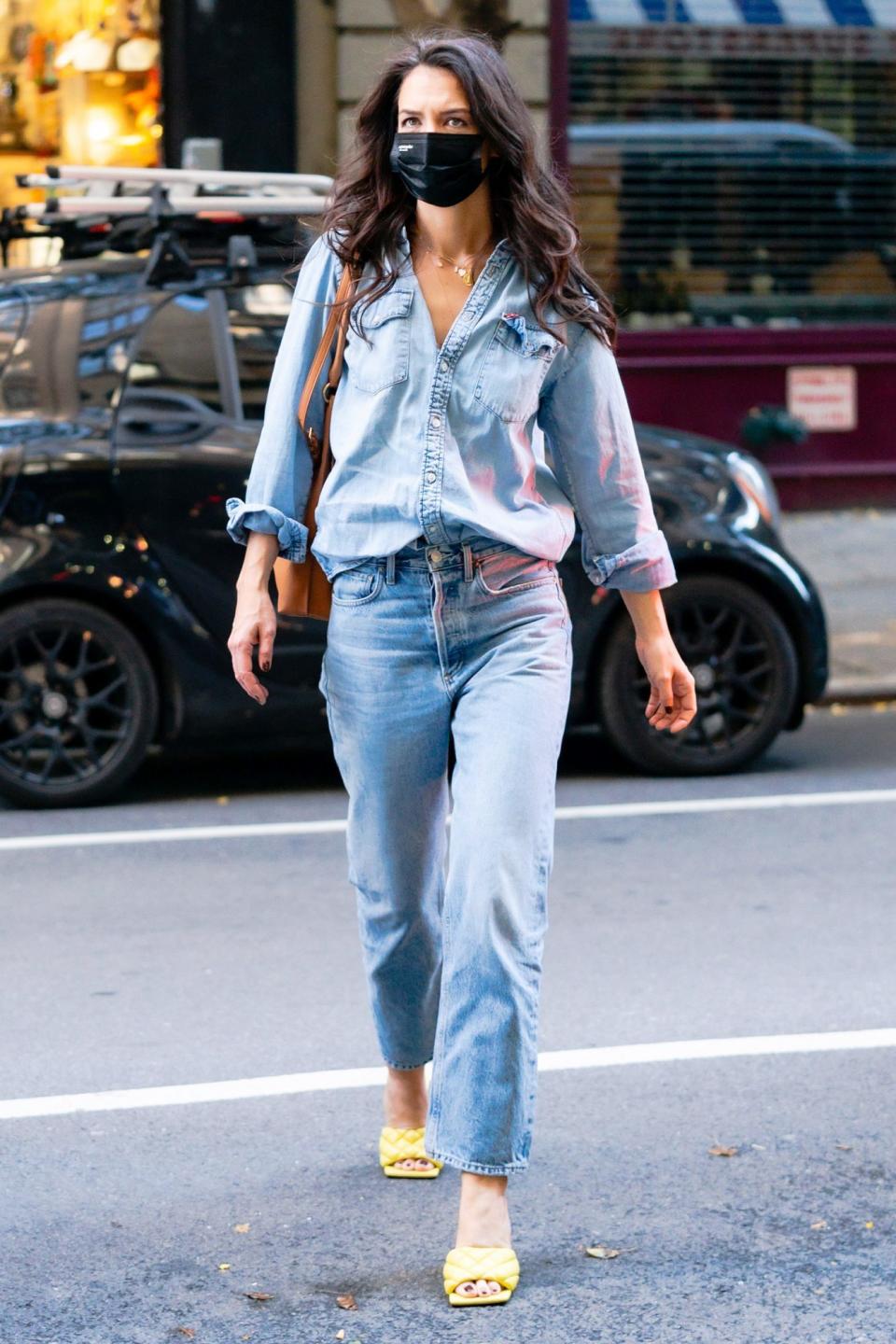 <p>Katie Holmes wears denim on denim with chic yellow mules while out in N.Y.C. on Monday.</p>