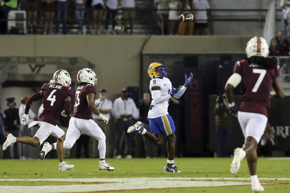 Pittsburgh's Bub Means (0) catches a touchdown pass against Virginia Tech during the first quarter of an NCAA college football game Saturday, Sept. 30, 2023, in Blacksburg, Va. (Matt Gentry/The Roanoke Times via AP)