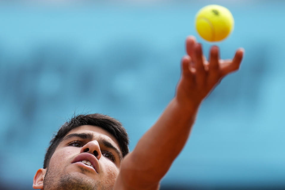 Carlos Alcaraz, of Spain, serves a ball to Alexander Shevchenko, of Kazakhstan, during the Mutua Madrid Open tennis tournament in Madrid, Friday, April 26, 2024. (AP Photo/Manu Fernandez)