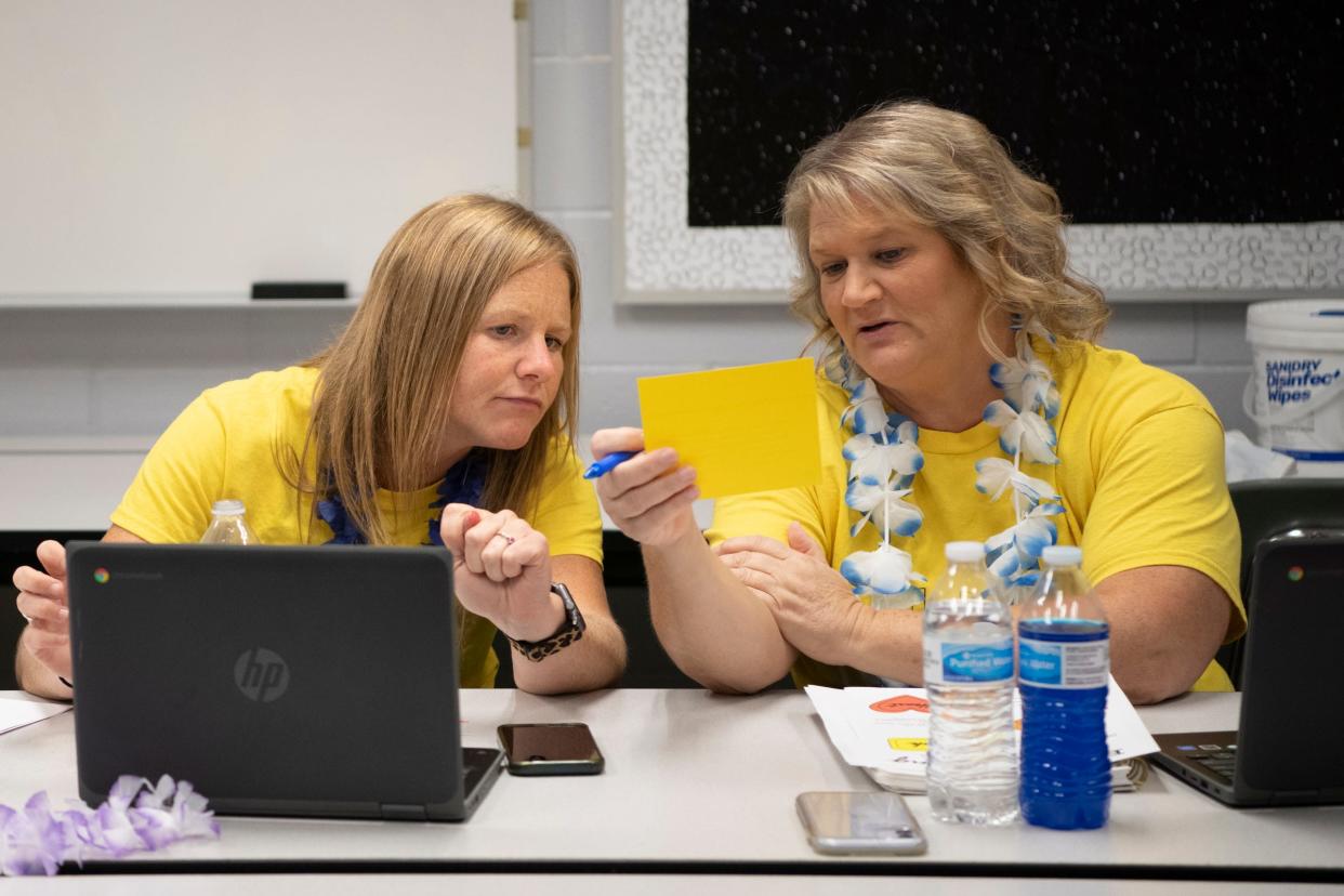 Paint Valley teachers Emilee Holden and Candy Mills work together as they and other teachers discuss discipline strategies for younger kids in Bainbridge, Ohio, on April 25, 2022.