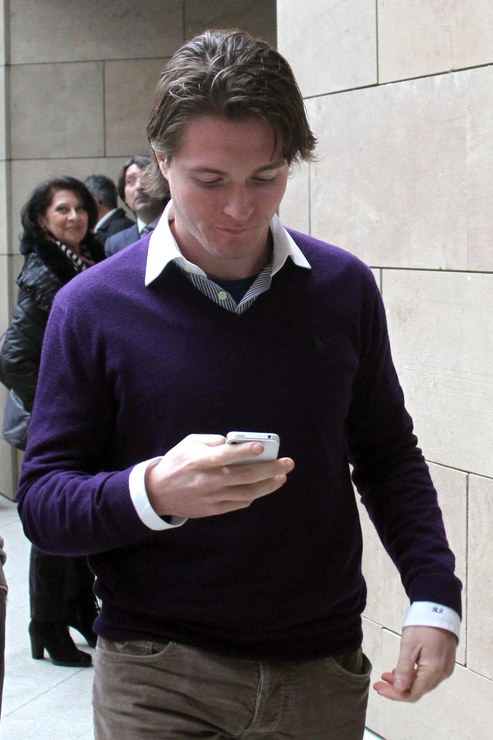 Raffaele Sollecito checks his smart phone as he enters the Florence court, Italy, Thursday, Jan. 9, 2013. The defense lawyer for the former boyfriend of U.S. exchange student Amanda Knox told an appeals court Thursday that the young lovers were blamed by authorities for the murder of British student Meredith Kercher to calm any fears that a monster was loose in their Italian university town. Defender Giulia Bongiorno said her client, Raffaele Sollecito, and Knox were identified as suspects in a "record" four days after the murder in the picturesque central town of Perugia because authorities "did not want to think that a stranger, a monster, could have entered a house and murdered a student." (AP Photo/Matteo Bovo, Lapresse)