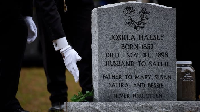 Members of the Grand Lodge of South Carolina honor Joshua Halsey at his grave site with community members at the Pine Forest Cemetery Saturday in Wilmington, N.C. Great-granddaughters of Halsey attended the service, where Rev. Dr. <span class="caas-xray-inline-tooltip"><span class="caas-xray-inline caas-xray-entity caas-xray-pill rapid-nonanchor-lt" data-entity-id="William_Barber_II" data-ylk="cid:William_Barber_II;pos:1;elmt:wiki;sec:pill-inline-entity;elm:pill-inline-text;itc:1;cat:ReligiousFigure;" tabindex="0" aria-haspopup="dialog"><a href="https://search.yahoo.com/search?p=William%20Barber%20II" data-i13n="cid:William_Barber_II;pos:1;elmt:wiki;sec:pill-inline-entity;elm:pill-inline-text;itc:1;cat:ReligiousFigure;" tabindex="-1" data-ylk="slk:William Barber;cid:William_Barber_II;pos:1;elmt:wiki;sec:pill-inline-entity;elm:pill-inline-text;itc:1;cat:ReligiousFigure;" class="link ">William Barber</a></span></span> eulogized Halsey, who was reportedly killed by a white supremacist mob in 1898. (Photo: Melissa Sue Gerrits/Getty Images)