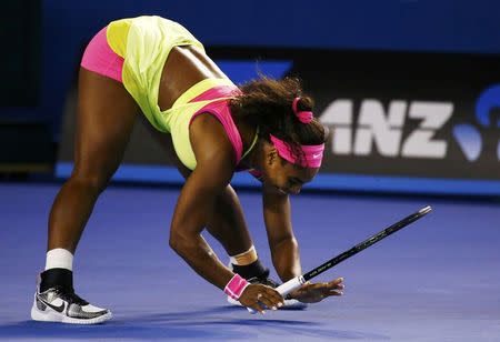 Serena Williams of the U.S. reacts after hitting a return to Maria Sharapova of Russia during their women's singles final match at the Australian Open 2015 tennis tournament in Melbourne January 31, 2015. REUTERS/Issei Kato