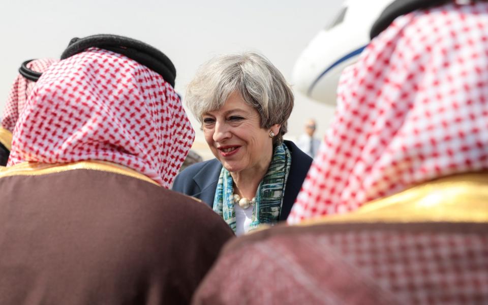 Theresa May arriving at King Khalid International Airport in Riyadh, Saudi Arabia, on Tuesday - Credit: Simon Dawson/Bloomberg