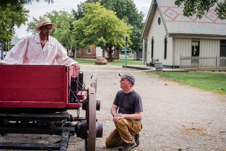 At the Ohio Village, filmmaker Scott Spears, right, talks to Jabari Johnson, portraying John Price in "A Higher Law."