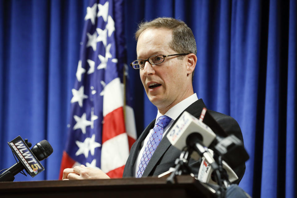 U.S. Attorney Benjamin C. Glassman speaks during a news conference, Wednesday, Oct. 10, 2018, in Cincinnati. The Justice Department says a Chinese intelligence operative has been charged with stealing trade secrets from multiple U.S. aviation and aerospace companies. Yanjun Xu was charged Wednesday with conspiring and attempting to commit economic espionage and theft of trade secrets. (AP Photo/John Minchillo)