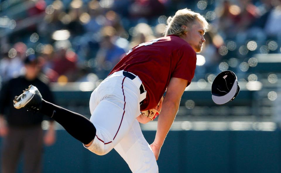 Harvard pitcher Owen Holt lost his hat repeatedly as he pitched against Alabama during game two of the weekend series with Harvard in Sewell-Thomas Stadium Saturday, Feb. 29, 2020. [Staff Photo/Gary Cosby Jr.] 