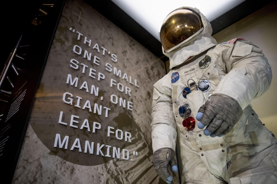 Neil Armstrong's Apollo 11 spacesuit is unveiled at the Smithsonian's National Air and Space Museum on the National Mall in Washington, Tuesday, July 16, 2019. (AP Photo/Andrew Harnik)