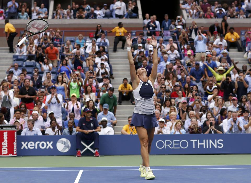 Flavia Pennetta of Italy celebrates after defeating compatriot Roberta Vinci in their women's singles final match at the U.S. Open Championships tennis tournament in New York, September 12, 2015. REUTERS/Eduardo Munoz