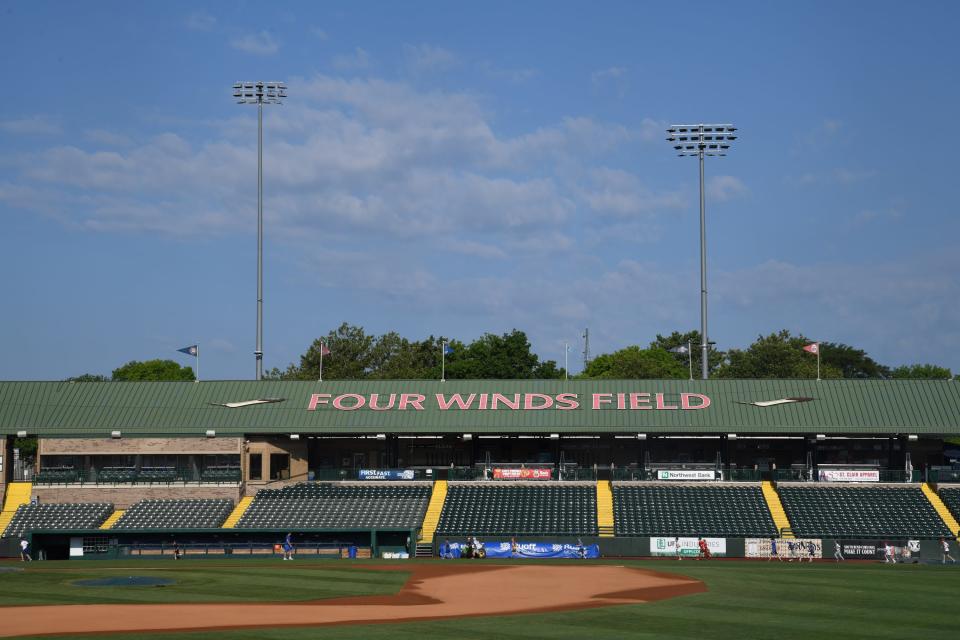 Children run laps at baseball camp at Four Winds Field on Friday July 7, 2023.