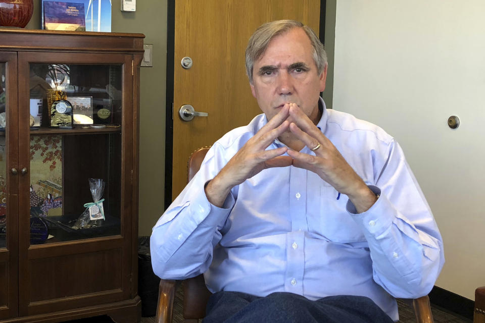 FILE - In this Sept. 7, 2018, file photo, Sen Jeff Merkley, D-Ore., sits for an interview in his office in Portland, Ore. National lawmakers, including Merkley, are expected on Wednesday, Dec. 2, 2020, to introduce a joint resolution aimed at striking language from the U.S. Constitution that enshrines a form of slavery in America’s foundational documents. (AP Photo/Andrew Selskey, File)