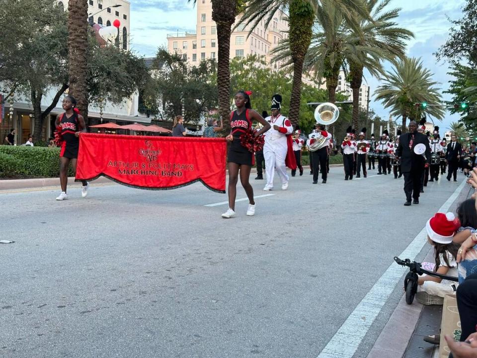 Members of the Arthur & Polly Mays Conservatory of the Arts marching band showcase at the 75th annual Junior Orange Bowl Parade in Coral Gables along Miracle Mile on Dec. 10, 2023.