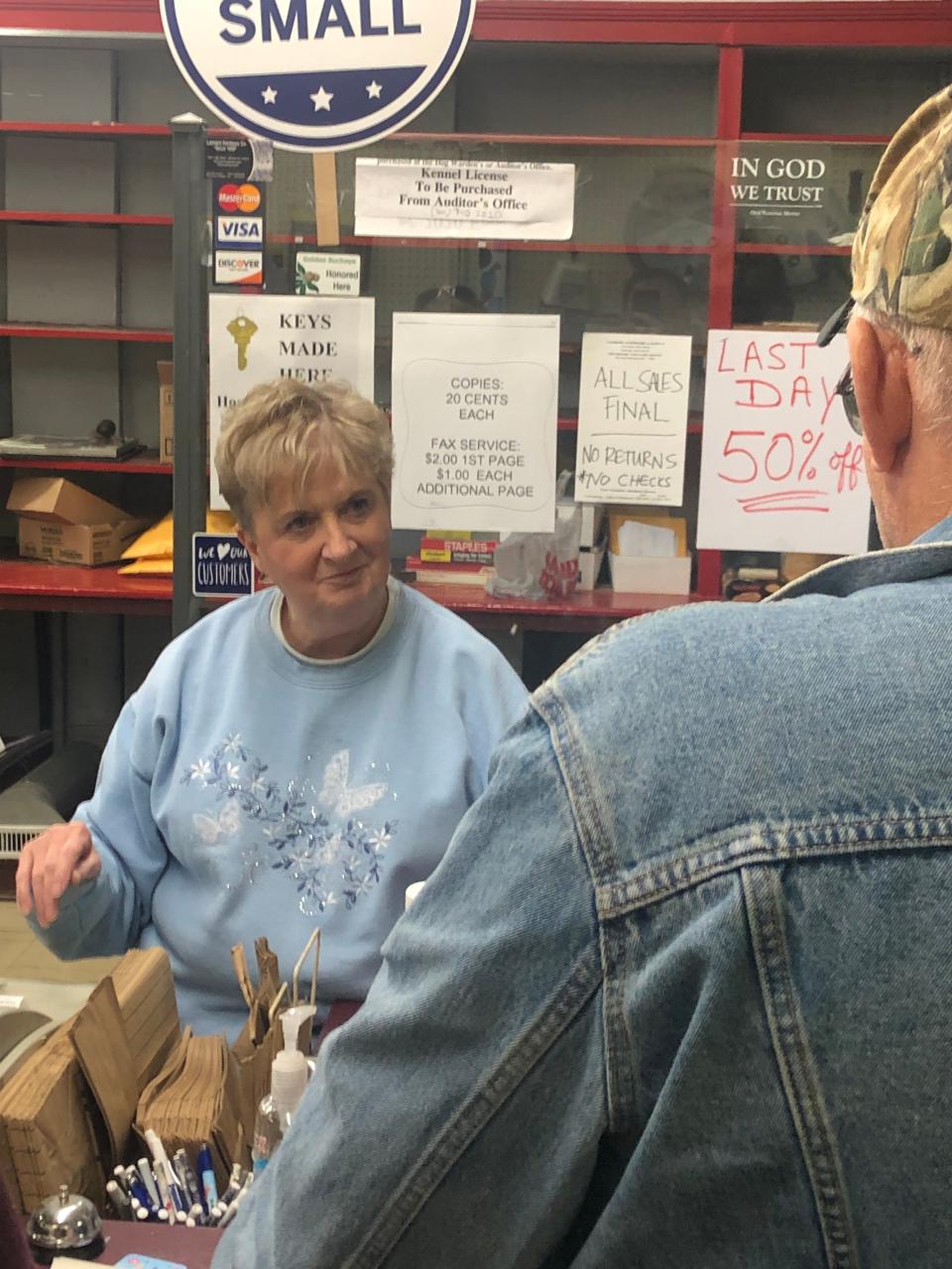 Sue Risbeck Sanor, owner of Leonard Hardware, checks out a customer who bought several items at the 123-year-old Sebring store. The store closed Friday, Sept. 30, 2022.