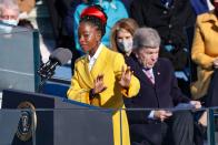 <p>The poet and activist wore a full head of embellished twists swept up and adorned with a bright red Prada hairband to speak at the inauguration of President Joe Biden.</p>