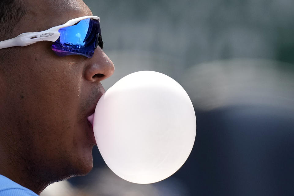 Kansas City Royals' Salvador Perez watches from the dugout during the ninth inning of a baseball game against the Minnesota Twins Sunday, July 4, 2021, in Kansas City, Mo. The Twins won 6-2. (AP Photo/Charlie Riedel)