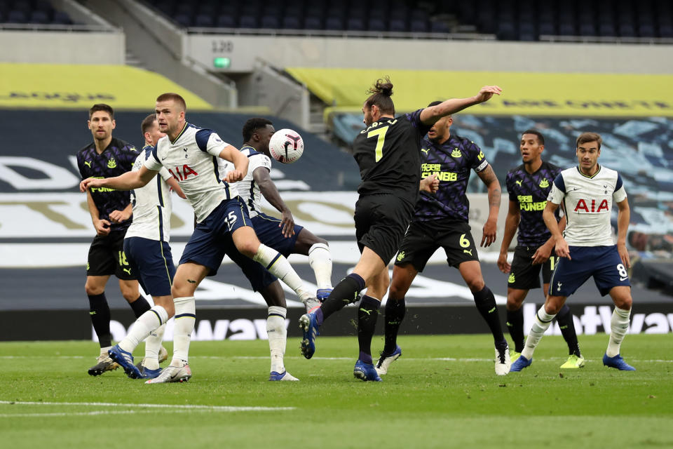 Tottenham's Eric Dier (15) was penalized for handball ... despite looking in the other direction. (Newcastle United/Getty Images)