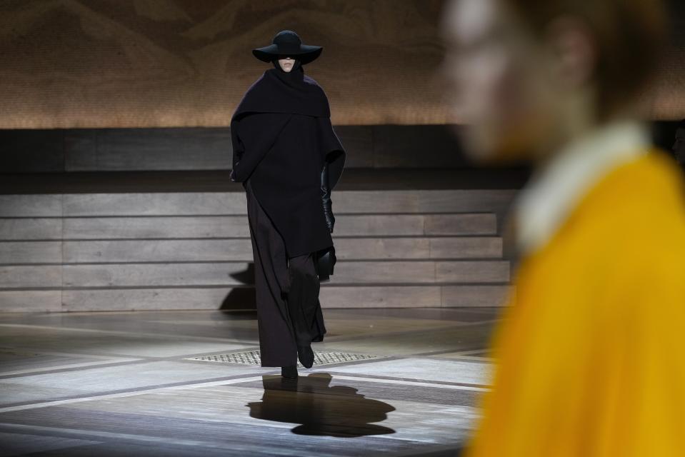 A model wears a creation as part of the Issey Miyake Fall/Winter 2024-2025 ready-to-wear collection presented Friday, March 1, 2024 in Paris. (Photo by Scott A Garfitt/Invision/AP)