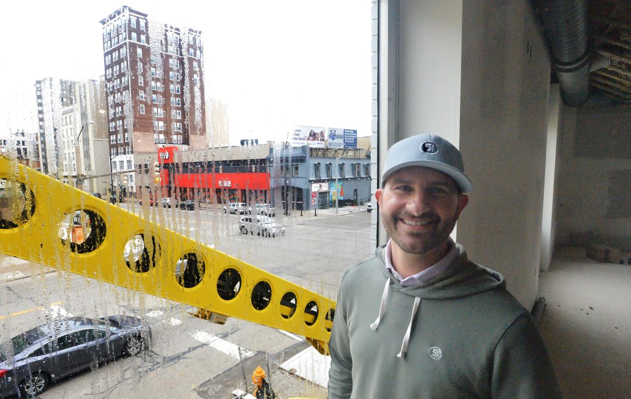 Five Iron Golf managing co-owner Chase Rogan, 39, is shown on the second floor, overlooking the intersection of 10th and State streets, inside the Erie location under construction on Feb. 8, 2024.