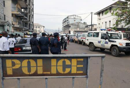 Police officers stand outide the central morgue at Connaught Hospital in Freetown, Sierra Leone August 16, 2017. REUTERS/Afolabi Sotunde