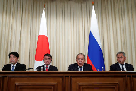 Russian Foreign Minister Sergei Lavrov, Defence Minister Sergei Shoigu, Japanese Foreign Minister Taro Kono and Defense Minister Itsunori Onodera attend a joint news conference following their meeting in Moscow, Russia July 31, 2018. REUTERS/Maxim Shemetov