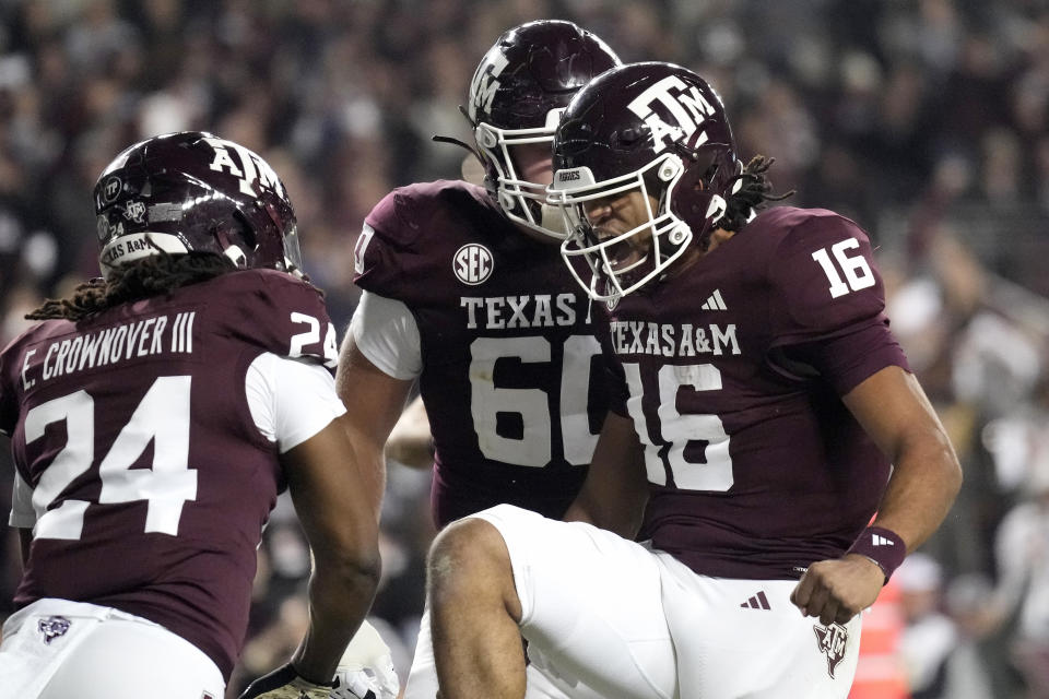 Texas A&M quarterback Jaylen Henderson (16) celebrates his touchdown against Mississippi State during the first quarter of an NCAA college football game Saturday, Nov. 11, 2023, in College Station, Texas. (AP Photo/Sam Craft)