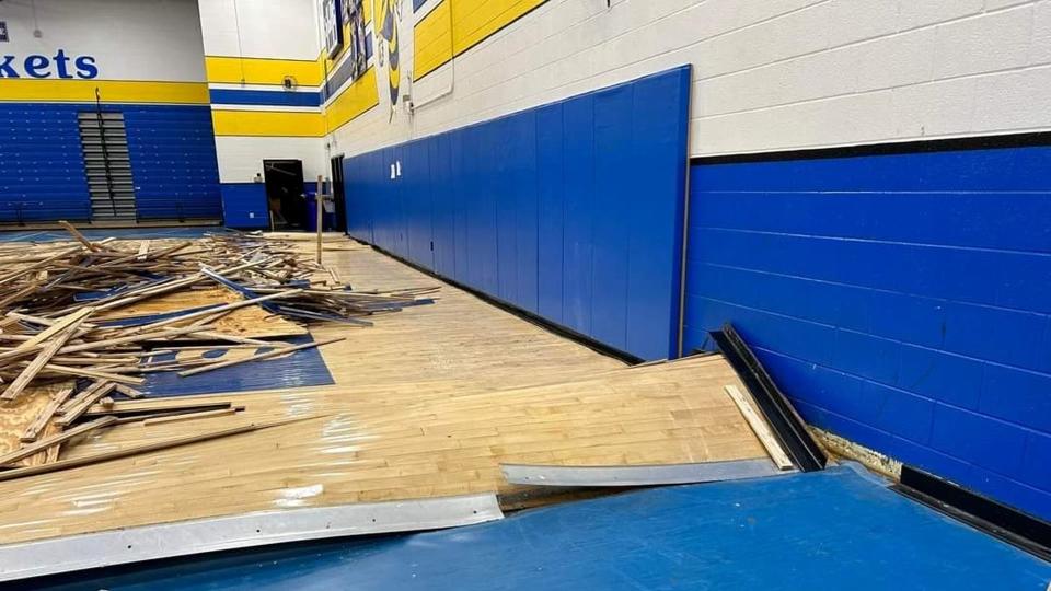 Water pipe burst in high school gym, ruining floors and making it unusable