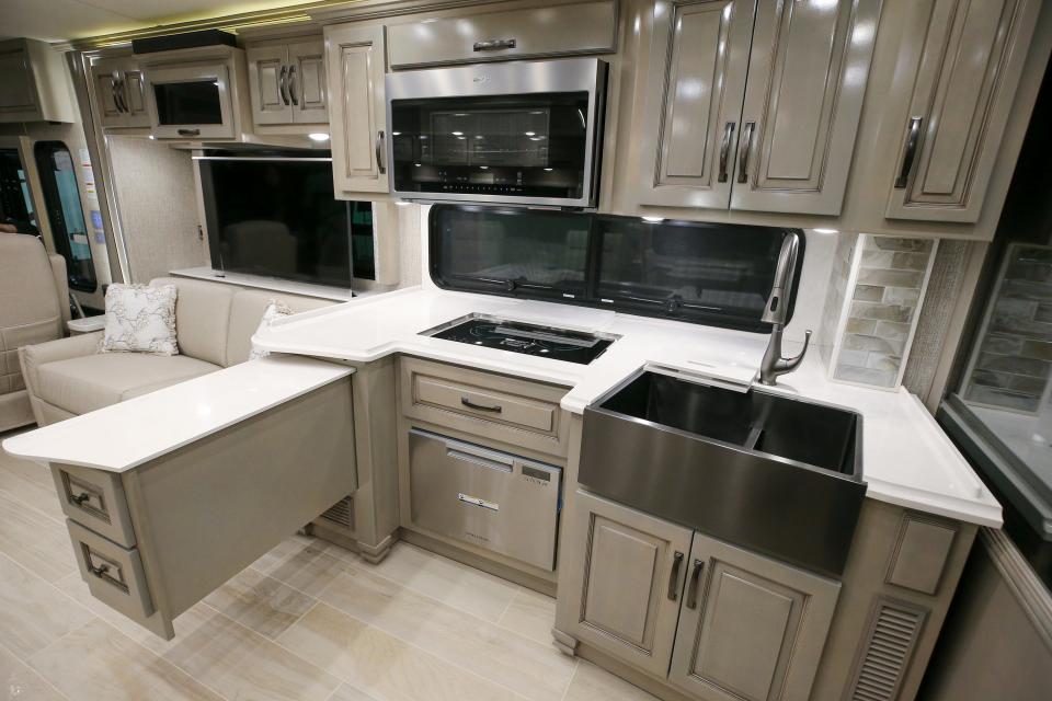 Main cabin and kitchen in the Newmar Dutch Star 4081 at Tom Stinnett RV in Clarksville.