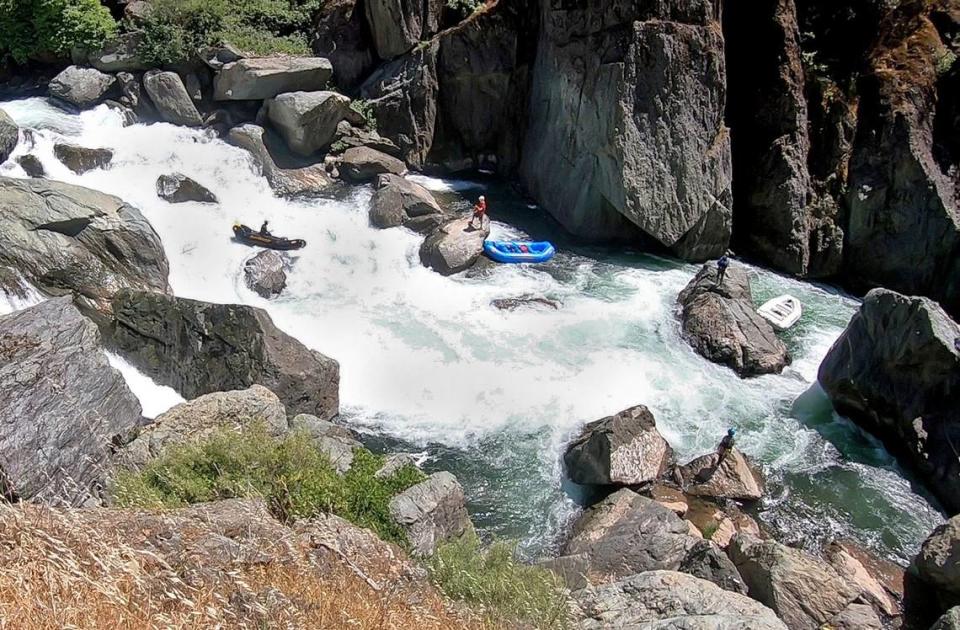 A guide with Sierra Whitewater maneuvers his raft on Ruck-A-Chucky Falls on the Middle Fork of the American River in May. The falls are considered too dangerous for a loaded raft, so passengers disembark and hike around the obstacle.