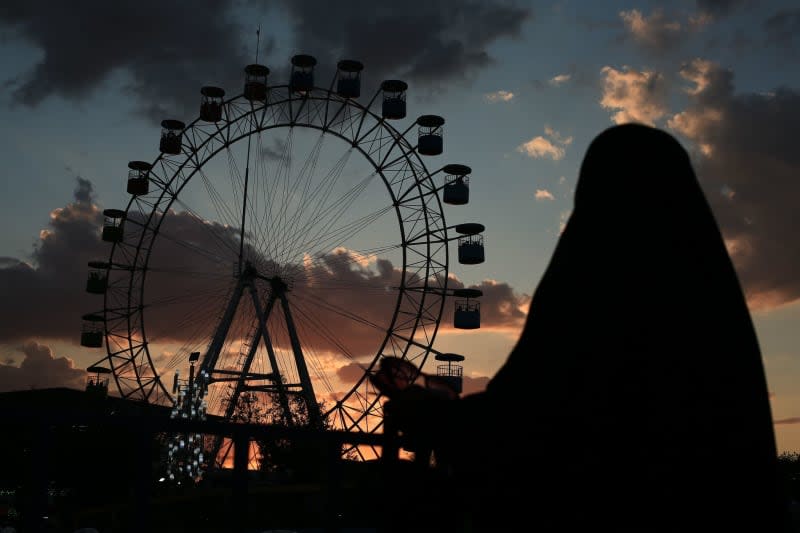 Citizens flock to Zayouna Games City on the second day of Eid al-Fitr, which is celebrated to mark the end of the month of Ramadan. Ameer Al-Mohammedawi/dpa