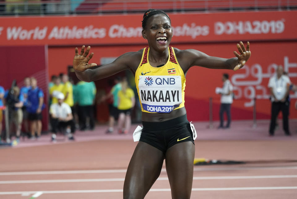 Halimah Nakaayi, of Uganda celebrates as she wins the gold medal in the women's 800 meter final at the World Athletics Championships in Doha, Qatar, Monday, Sept. 30, 2019. (AP Photo/David J. Phillip)