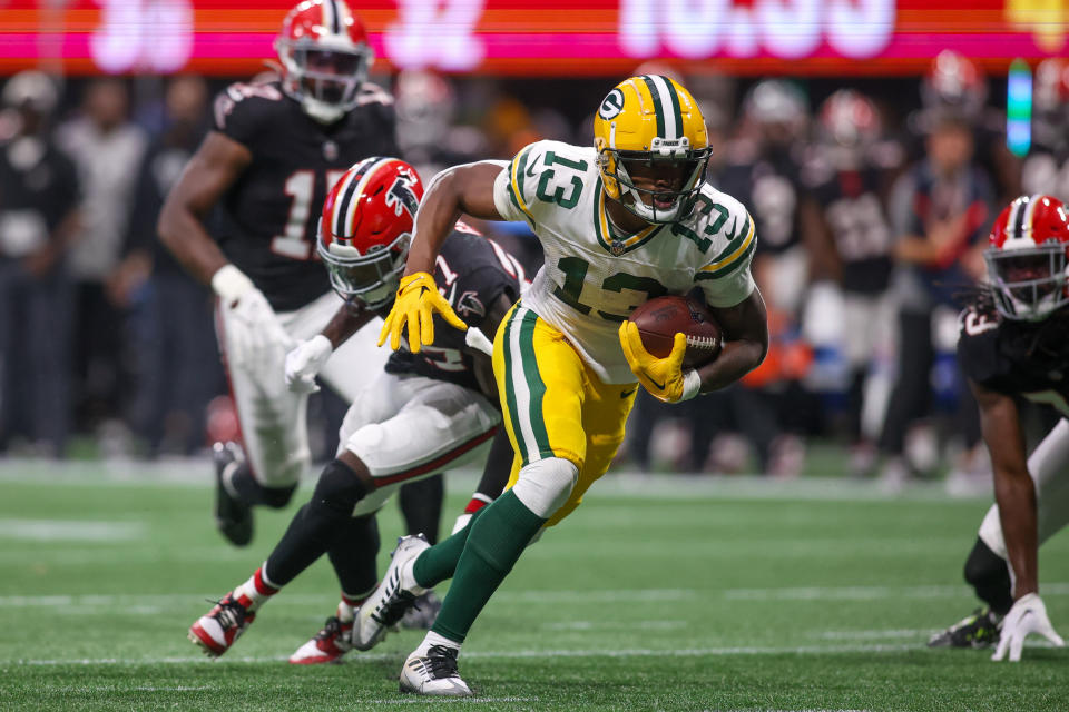 Sep 17, 2023; Atlanta, Georgia, USA; Green Bay Packers wide receiver Dontayvion Wicks (13) runs for a touchdown against the Atlanta Falcons in the second half at Mercedes-Benz Stadium. Mandatory Credit: Brett Davis-USA TODAY Sports