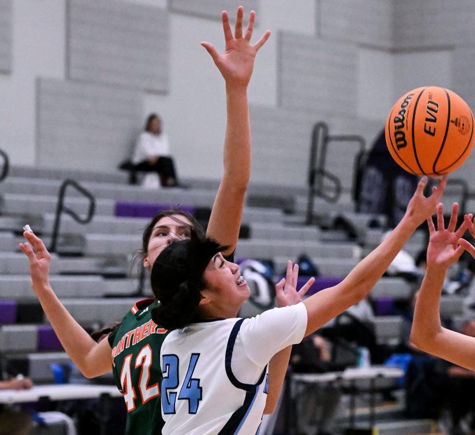 Redwood's Brooklyn Tayo tries for two against Porterville in an East Yosemite League high school girls basketball game Tuesday, January 31, 2023 at Ridge View Middle School. 