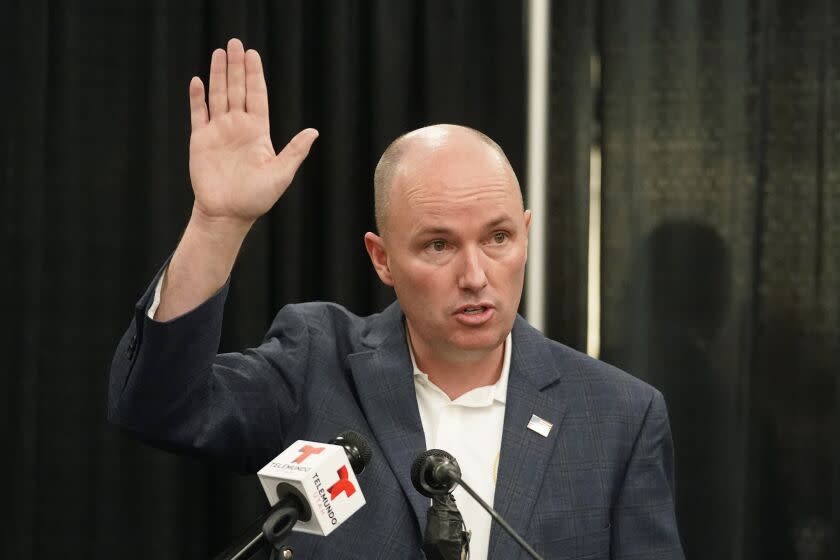 Utah Gov. Spencer Cox speaks during a news conference before receiving his first dose of the Pfizer vaccine Thursday, March 25, 2021, in Spanish Fork, Utah. Utah is on pace to remove all coronavirus-related restrictions by July if transmission rates keep dropping, but the situation could change, Cox said Thursday. He urged residents to get vaccinated as soon as possible and to remain cautious. (AP Photo/Rick Bowmer)