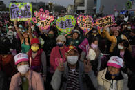 Supporters of the Democratic Progressive Party cheer at a rally in southern Taiwan's Tainan city on Friday, Jan. 12, 2024 ahead of the presidential election on Saturday. (AP Photo/Ng Han Guan)