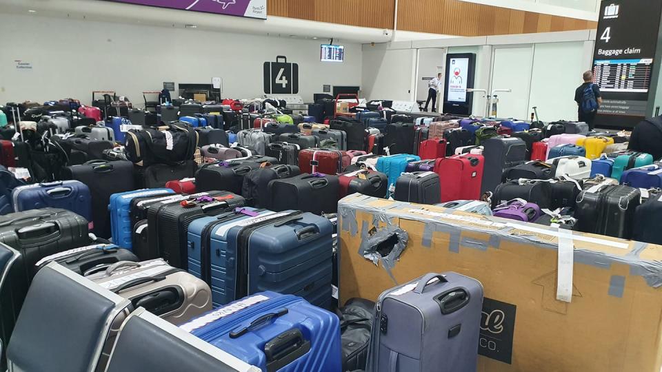 A photo showing hundreds of suitcases at a Qantas terminal at Perth airport.