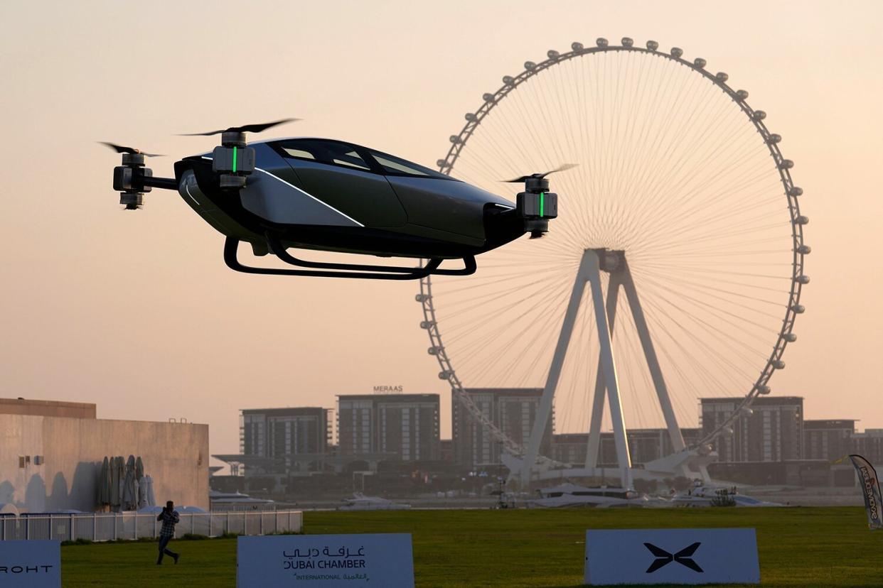 XPeng X2, an electric flying taxi developed by the Guangzhou-based XPeng, Inc's aviation affiliate, is tested in front of the Marina District in Dubai, United Arab Emirates