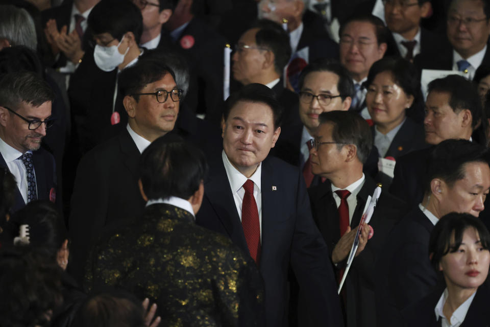 South Korea's President Yoon Suk Yeol, center, arrives for a ceremony of the 105th anniversary of the March 1st Independence Movement Day in Seoul, South Korea, Friday, March 1, 2024. (Kim Hong-Ji/Pool Photo via AP)