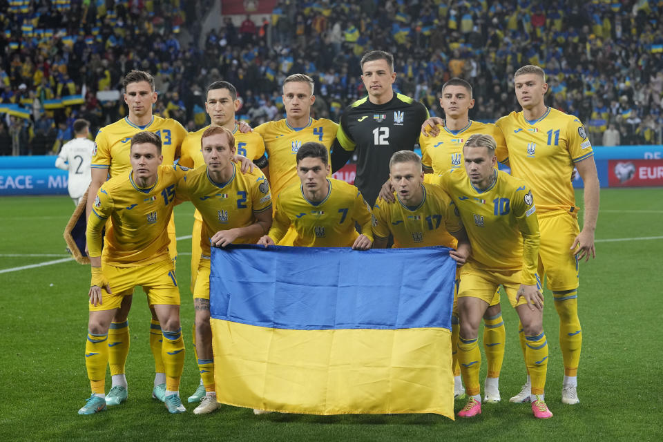 Ukraine squad pose before the Euro 2024 group C qualifying soccer match between Ukraine and Italy at the BayArena in Leverkusen, Germany, Monday, Nov. 20, 2023. (AP Photo/Martin Meissner)