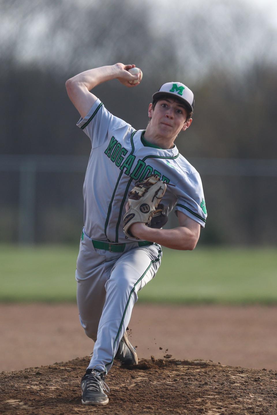 Mogadore pitcher Ronnie Skye throws from the mound during Thursday night's game at Rootstown High School.
