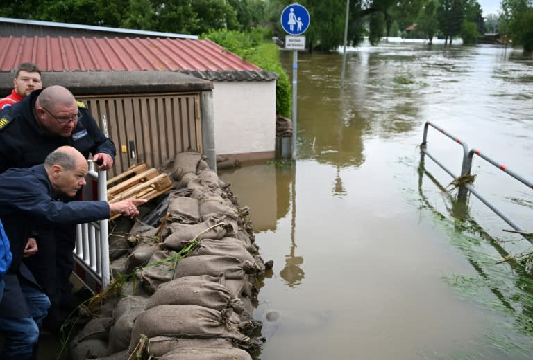 German Chancellor Olaf Scholz drew links to climate change as he visited flood-hit areas in southern Germany (LUKAS BARTH)