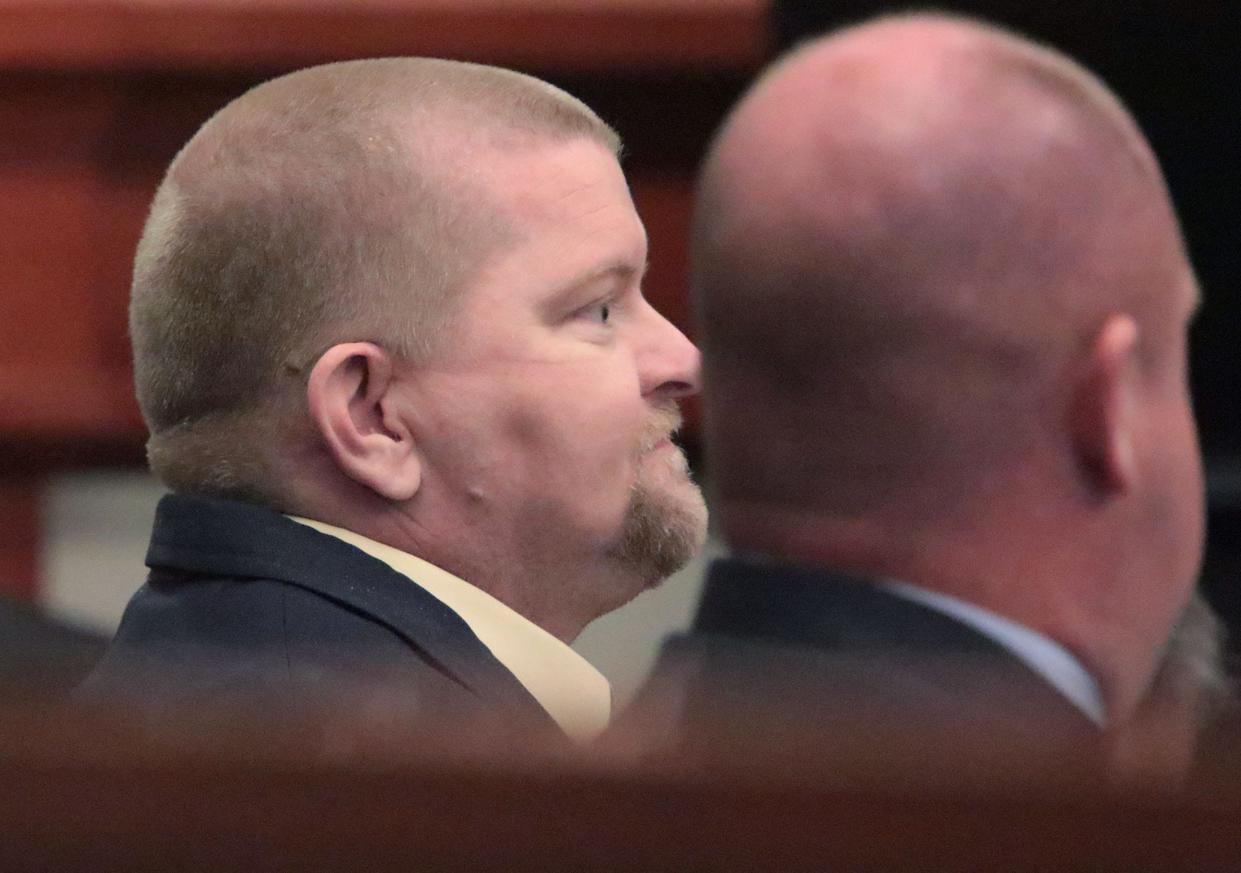 Robert Kern removes his face mask so a witness can identify him during his trial for the 2018 killing of 16-year-old Justis Marie Garrett, Wednesday, Aug. 3, 2022, in the Volusia County Courthouse in DeLand.