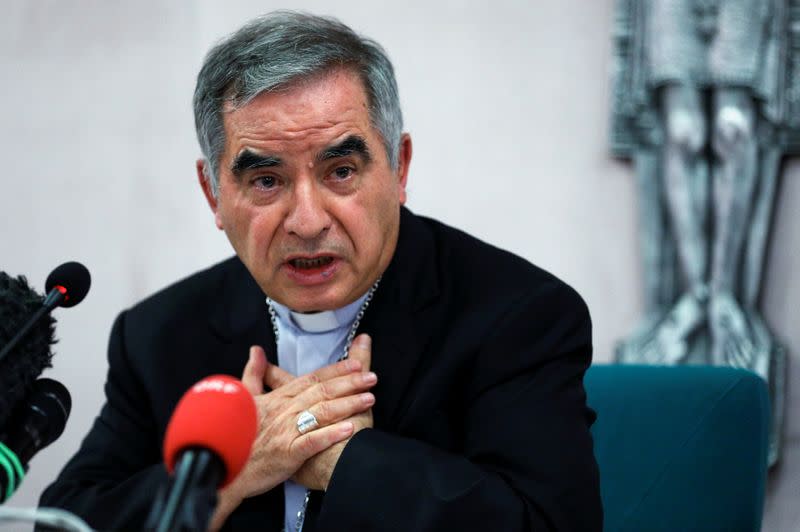 Cardinal Giovanni Angelo Becciu speaks to the media in Rome