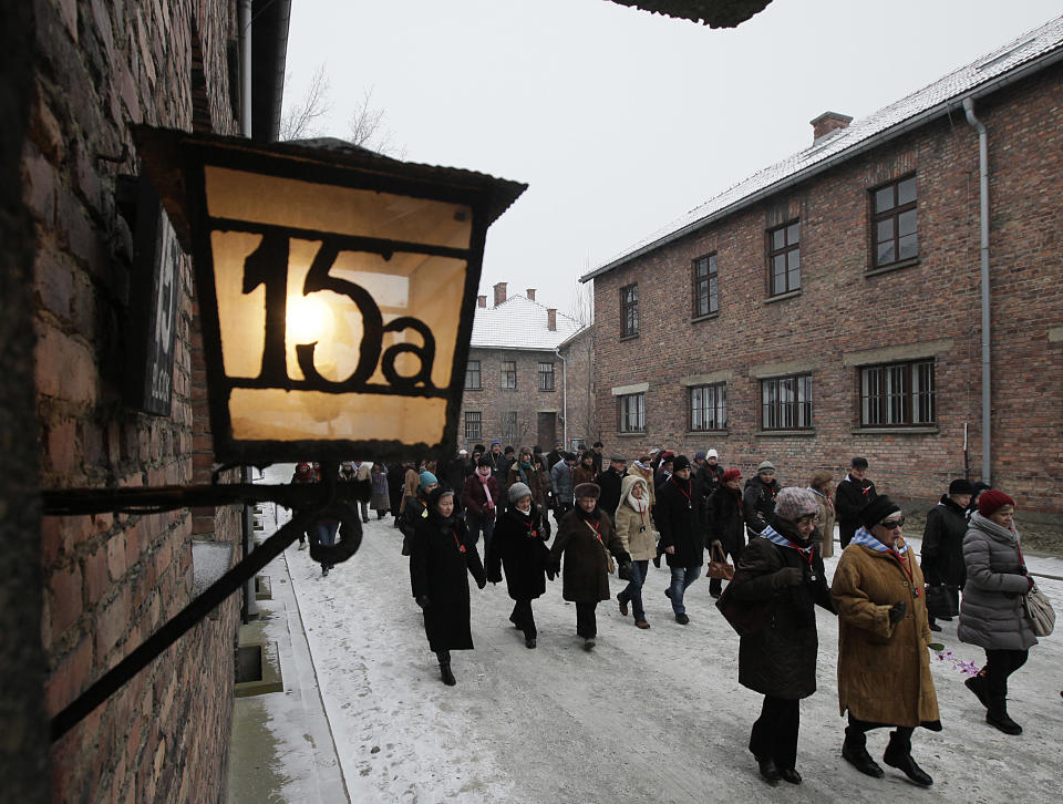 Holocaust survivors arrive for a ceremony to mark the 69th anniversary of the liberation of Auschwitz Nazi death camp's in Oswiecim, Poland, on Monday, Jan. 27, 2014, since the Soviet Red Army liberated the camp. Israeli lawmakers and government officials are to attend anniversary observances later in the day. The Nazis killed some 1.5 million people, mostly Jews at the camp during World War II. (AP Photo/Czarek Sokolowski)