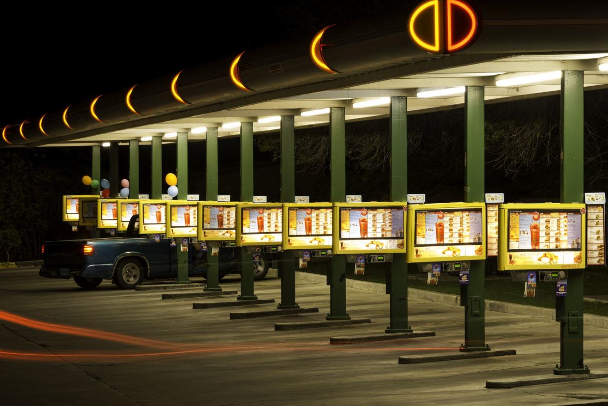  Sonic Drive-In Restaurant on Route 66 at night.